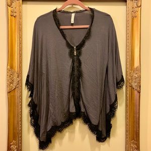gray zip up poncho with black lace